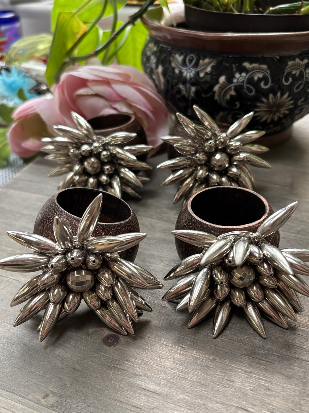 Silver Stellar Napkin Rings with a Burst of Metallic Beads Wood Base